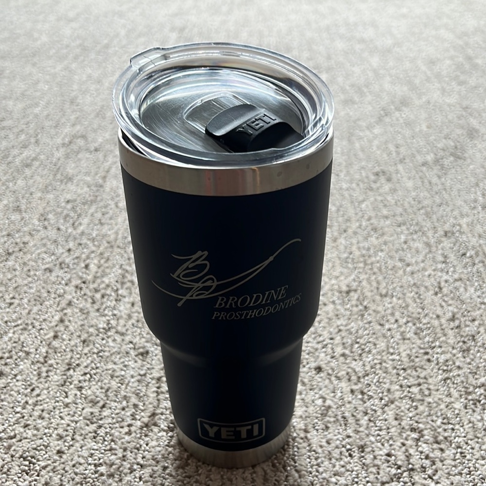 Yeti 30oz tumbler, navy blue with logo on it.